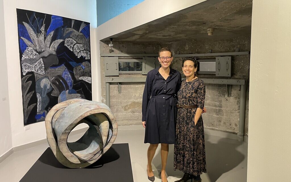 Artists Sarah Benninga (left) and Rachel Rotenberg at the December 28, 2022 Museum on the Seam reopening of 'Kravot,' their exhibit that includes nude imagery and was previously shuttered. (Jessica Steinberg/Times of Israel)