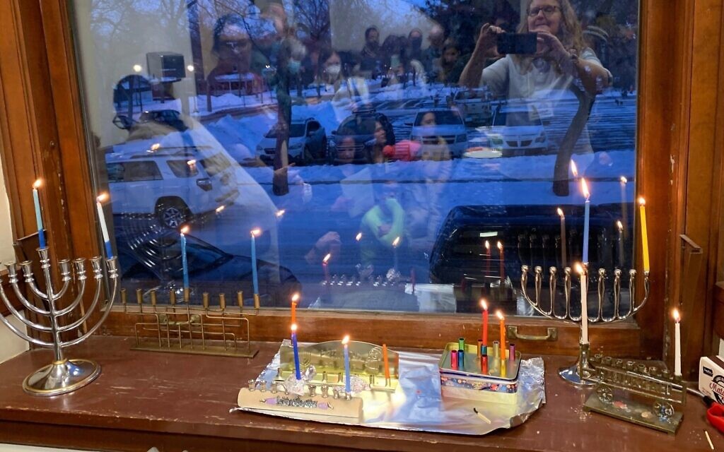 For the first time in nearly 90 years, Hanukkah lights shine from Temple Emanu-El in Helena, Montana, December 18, 2022. (Courtesy of Montana Jewish Project via JTA)