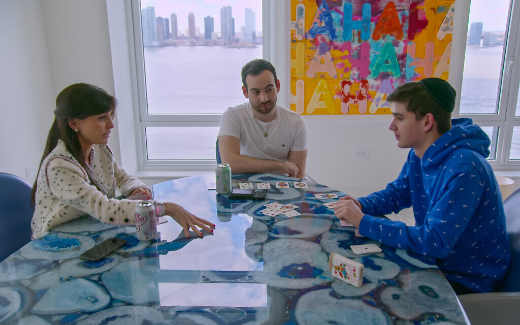 Julia Haart speaks to Shlomo (center) and Aron (right) in an episode of season two of 'My Unorthodox Life.' (Netflix)