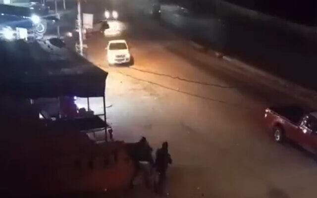 Gunmen are seen opening fire at a police checkpoint in the Egyptian city of Ismailia, purportedly in an attack on December 30, 2022, in a video circulated on social media. (Screenshot: Twitter)