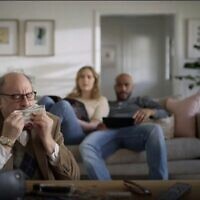 An ad for student debt refinancing company SoFi depicts a man stealing money from a young couple that was critizied as looking ike an antisemitic stereotype. (Screenshot via JTA)