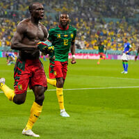 Cameroon's Vincent Aboubakar, left, celebrates after scoring during the World Cup group G soccer match between Cameroon and Brazil, at the Lusail Stadium in Lusail, Qatar, December 2, 2022. (AP Photo/Andre Penner)