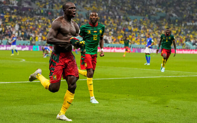 Cameroon's Vincent Aboubakar, left, celebrates after scoring during the World Cup group G soccer match between Cameroon and Brazil, at the Lusail Stadium in Lusail, Qatar, December 2, 2022. (AP Photo/Andre Penner)