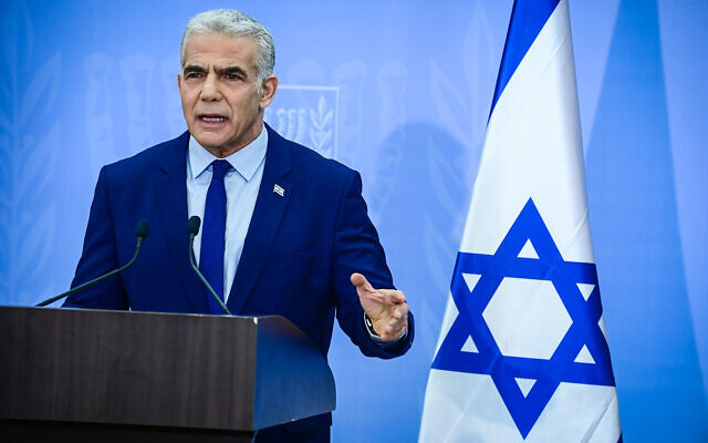 Outgoing Prime Minister Yair Lapid holds a press conference in Tel Aviv on December 22, 2022. (Tomer Neuberg/Flash90)