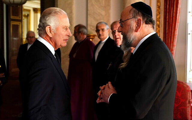 Britain's King Charles III speaks to UK Chief Rabbi Ephraim Mirvis as he meets with faith leaders during a reception at Buckingham Palace, London September 16, 2022. (Aaron Chown/Pool Photo via AP)