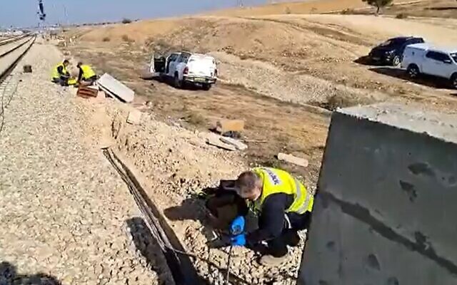 Engineers inspect an area where train signaling cables were stolen near Lehavim, December 10, 2022 (Screen grab used in accordance with Clause 27a of the Copyright Law)
