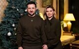 This handout picture taken and released by Ukrainian Presidential Office on December 31, 2022 shows the President Volodymyr Zelensky and his wife Olena during their New Year's address to Ukrainian people. (Photo by AFP)