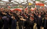 Iranians react during a commemoration ceremony in the capital Tehran on January 3, 2023 marking the third anniversary of the US killing of top Iranian Revolutionary Guards commander Qasem Soleimani and Iraqi commander Abu Mahdi al-Muhandis. (ATTA KENARE / AFP)