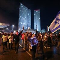Israeli protesters attend a rally against Prime Minister Benjamin Netanyahu's new government in Tel Aviv on January 14, 2023. (Ahmad Gharabli/AFP)
