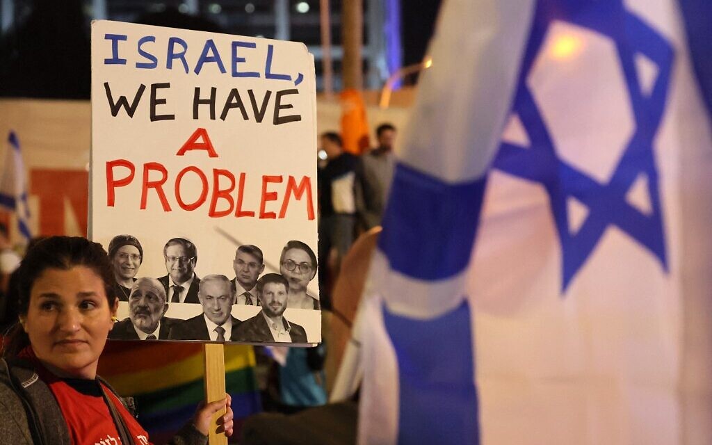 A protester attends a rally against Prime Minister Benjamin Netanyahu's new hard-right government in the coastal city of Tel Aviv on January 21, 2023. (Jack Guez/AFP)