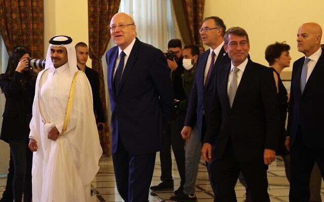 (L to R) Qatar's minister of state for Energy Affairs and president and CEO of QatarEnergy Saad Sherida al-Kaabi, Lebanon's caretaker Prime Minister Najib Mikati, chairman and CEO of Total Energies Patrick Pouyanne, Lebanon's caretaker Energy Minister Walid Fayad and CEO of Italian multinational oil and gas company ENI Claudio Descalzi arrive for a joint signing ceremony for offshore gas exploration in the capital Beirut on January 29, 2023. (NWAR AMRO / AFP)