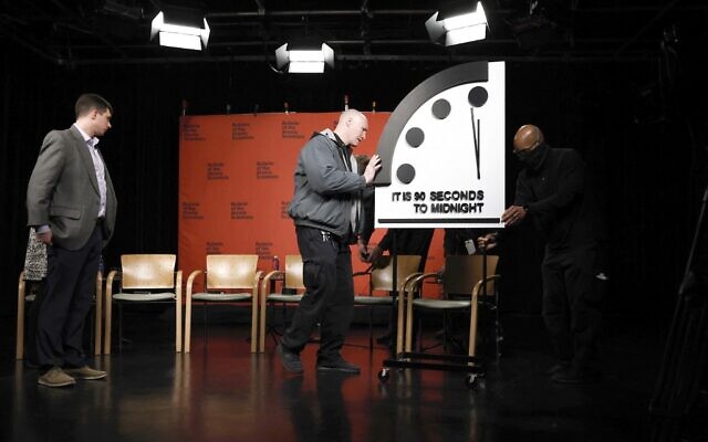 The 2023 Doomsday Clock is moved, ahead of a live-streamed event with members of the Bulletin of the Atomic Scientists, on January 24, 2023 in Washington, DC. (Anna Moneymaker / GETTY IMAGES NORTH AMERICA / Getty Images via AFP)