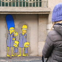 Artist aleXsandro Palombo painted several images of characters from 'The Simpsons' as Holocaust victims on the outside of Milan's central train station. (Courtesy of Palombo via JTA)