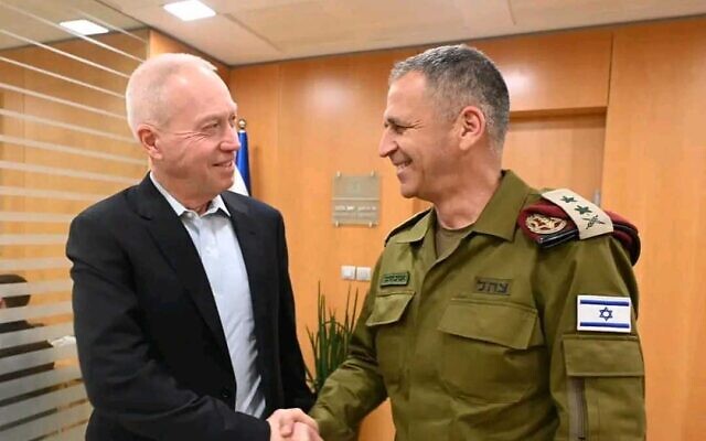 Defense Minister Yoav Gallant meets with outgoing IDF chief Aviv Kohavi at his office in Tel Aviv, January 15, 2023. (Ariel Hermoni/Defense Ministry)