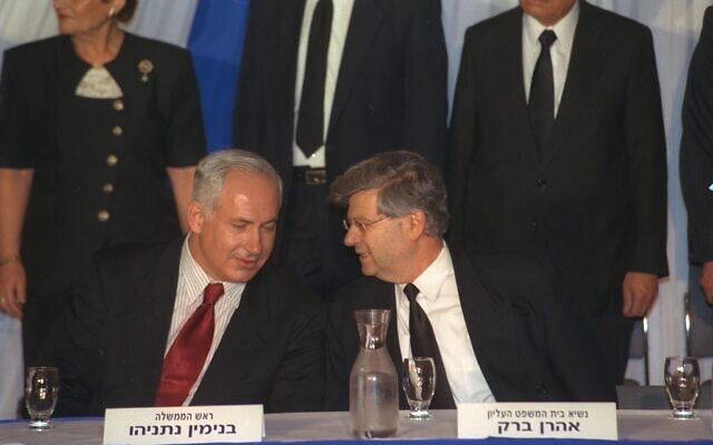 Prime Minister Benjamin Netanyahu and then-Supreme Court president Aharon Barak at a September 1998 Supreme Court ceremony marking 50 years of the Israeli court system. (GPO via Wikipedia)