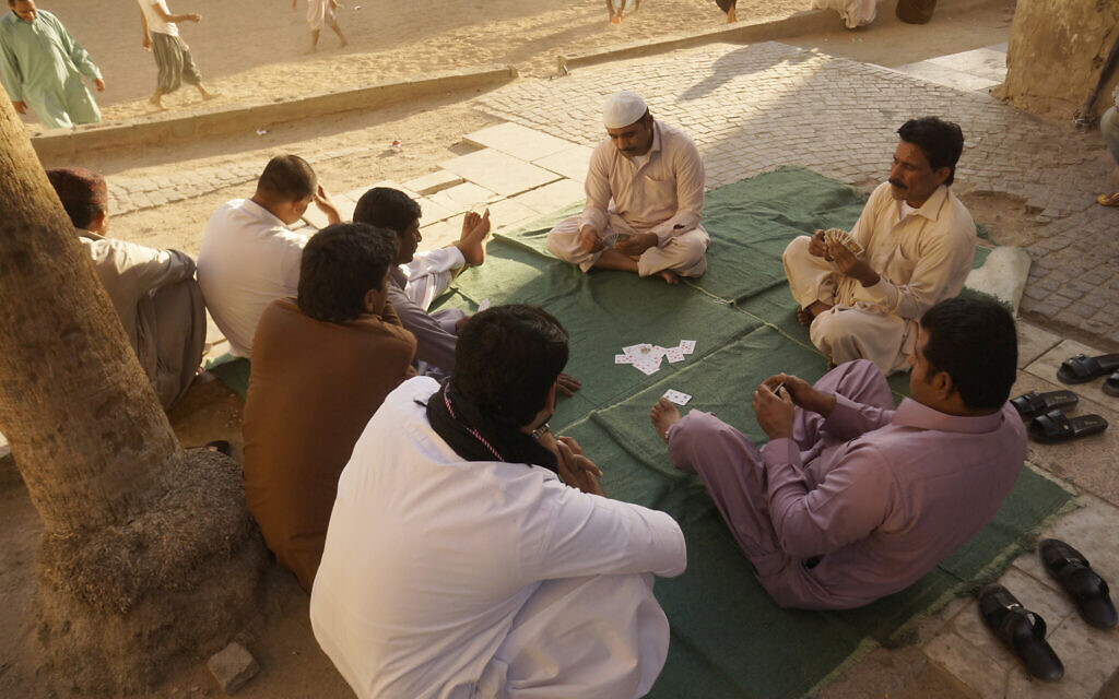 Workers play cards in the Old City of Jeddah, Saudi Arabia, January 24, 2020. (AP Photo/Amr Nabil, File)