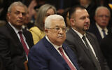 Palestinian Authority President Mahmoud Abbas, center, attends a Christmas midnight Mass in the Church of the Nativity in the West Bank town of Bethlehem, December 25, 2022. (Ahmad Gharabli/Pool Photo via AP)