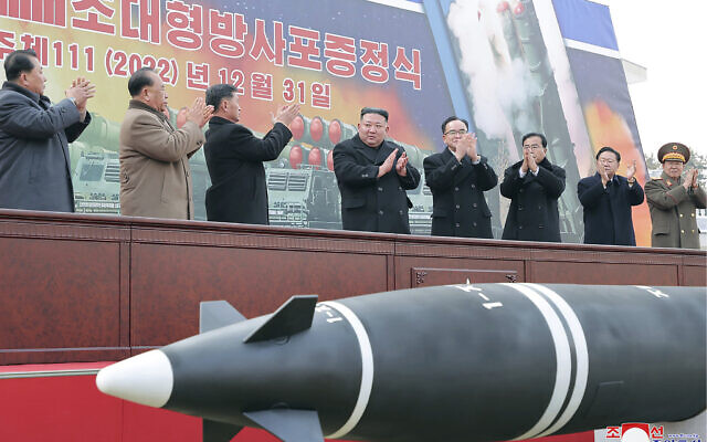 In this photo provided by the North Korean government, North Korean leader Kim Jong Un, center, attends a ceremony of donating 600mm super-large multiple launch rocket system at a garden of the Workers’ Party of Korea headquarters in Pyongyang, North Korea, December 31, 2022. (Korean Central News Agency/Korea News Service via AP)