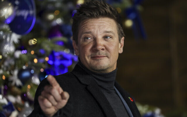 Jeremy Renner poses for photographers upon arrival at the UK Fan Screening of the film 'Hawkeye,' in London, November 11, 2021. (Vianney Le Caer/Invision/AP)