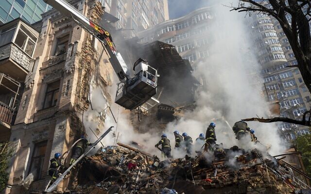 File: Firefighters work after a drone attack on buildings in Kyiv, Ukraine, Monday, Oct. 17, 2022. (AP Photo/Roman Hrytsyna)