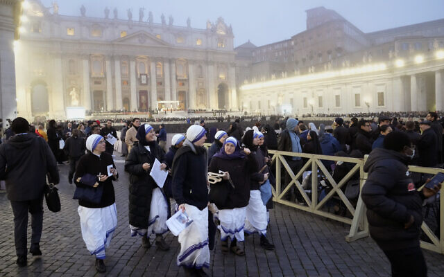 Faithful walk into St. Peter's Square at the Vatican, ahead of the funeral mass for late Pope Emeritus Benedict XVI, January 5, 2023. (Gregorio Borgia/AP)
