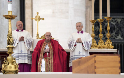 Pope Francis sits by the coffin of late Pope Emeritus Benedict XVI St. Peter's Square during a funeral mass at the Vatican, January 5, 2023. (Andrew Medichini/AP)