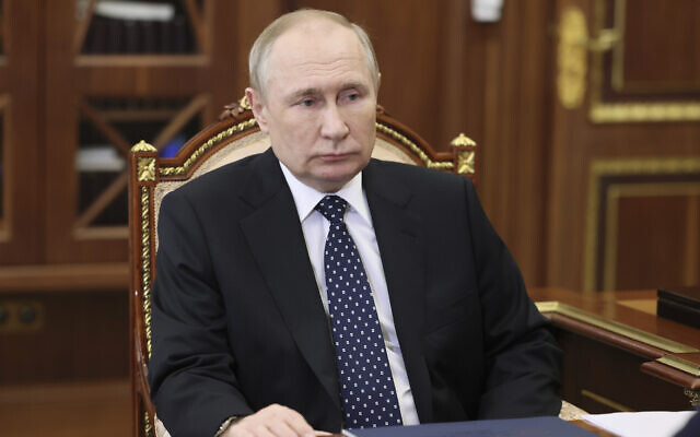 Russian President Vladimir Putin attends a meeting in Moscow, Russia, January 5, 2023. (Mikhail Klimentyev, Sputnik, Kremlin Pool Photo via AP)
