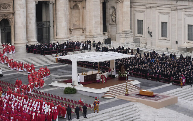 Pope Francis, centre, starts a funeral mass as the coffin of late Pope Emeritus Benedict XVI is placed at St. Peter's Square at the Vatican, Thursday, Jan. 5, 2023. Benedict died at 95 on Dec. 31 in the monastery on the Vatican grounds where he had spent nearly all of his decade in retirement, his days mainly devoted to prayer and reflection. (AP Photo/Antonio Calanni)