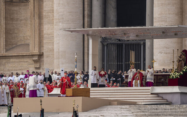 Dean of the College of Cardinals, Giovanni Battista Re, center, censes the coffin containing the body of Pope Emeritus Benedict XVI during his funeral mass presided over by Pope Francis, right, in St. Peter's Square at The Vatican, Thursday, Jan. 5, 2023. Benedict died at 95 on Dec. 31 in the monastery on the Vatican grounds where he had spent nearly all of his decade in retirement. (AP Photo/Domenico Stinellis)