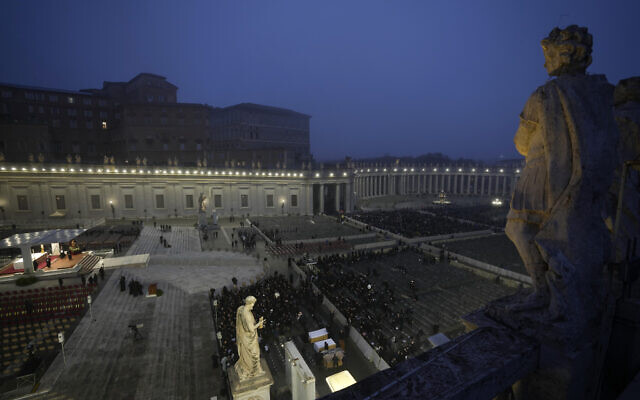 People start taking their seats at dawn ahead of the funeral mass for late Pope Emeritus Benedict XVI in St. Peter's Square at the Vatican, Thursday, Jan. 5, 2023. Benedict died at 95 on Dec. 31 in the monastery on the Vatican grounds where he had spent nearly all of his decade in retirement. (AP Photo/Ben Curtis)