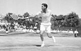 Dick Savitt hits a shot during a Davis Cup tennis match against Fumiteru Nakano of Japan, in Louisville, Kentucky, on July 20, 1951 (AP Photo/H.B. Littell, File)