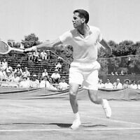 Dick Savitt hits a shot during a Davis Cup tennis match against Fumiteru Nakano of Japan, in Louisville, Kentucky, on July 20, 1951 (AP Photo/H.B. Littell, File)