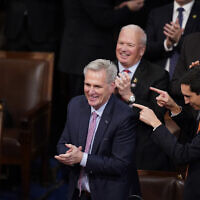 Rep. Kevin McCarthy smiles after winning the 15th vote in the House chamber as the House enters the fifth day trying to elect a speaker and convene the 118th Congress in Washington, early Saturday, January 7, 2023. (AP Photo/Alex Brandon)