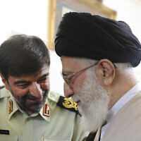 In this undated photo released January 7, 2023, Iran's Supreme Leader Ayatollah Ali Khamenei (right) speaks with Gen. Ahmad Reza Radan, the newly appointed police chief of Iran. (Office of the Iranian Supreme Leader via AP)