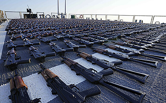 Hundreds of AK-47 assault rifles sit on the flight deck of the guided-missile destroyer USS The Sullivans during an inventory process, Jan. 7, 2023, after they were seized from a ship heading for Yemen. (US Navy photo via AP)