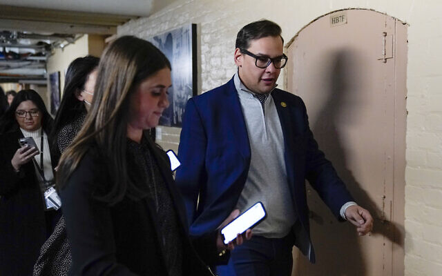 Rep. George Santos, R-N.Y., departs after attending a House GOP conference meeting on Capitol Hill in Washington, Tuesday, Jan. 10, 2023. (AP Photo/Patrick Semansky)