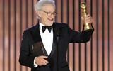 This image released by NBC shows Steven Spielberg accepting the Best Director award for 'The Fabelmans' during the 80th Annual Golden Globe Awards at the Beverly Hilton Hotel on Tuesday, Jan. 10, 2023, in Beverly Hills, Calif. (Rich Polk/NBC via AP)
