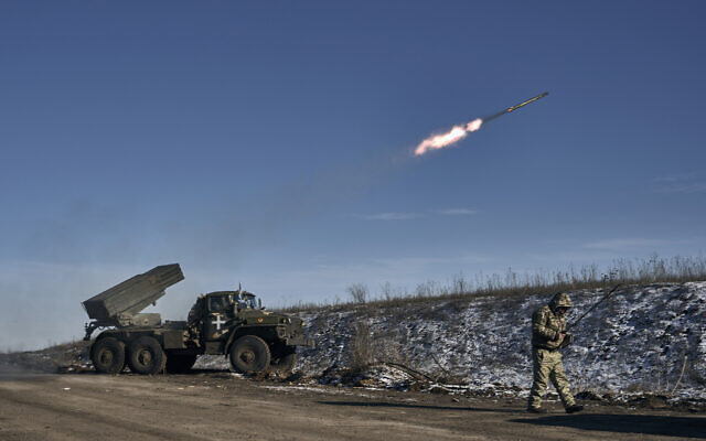 Ukrainian army Grad multiple rocket launcher fires rockets at Russian positions in the frontline near Soledar, Donetsk region, Ukraine, Wednesday, January 11, 2023. (AP Photo/Libkos, File)