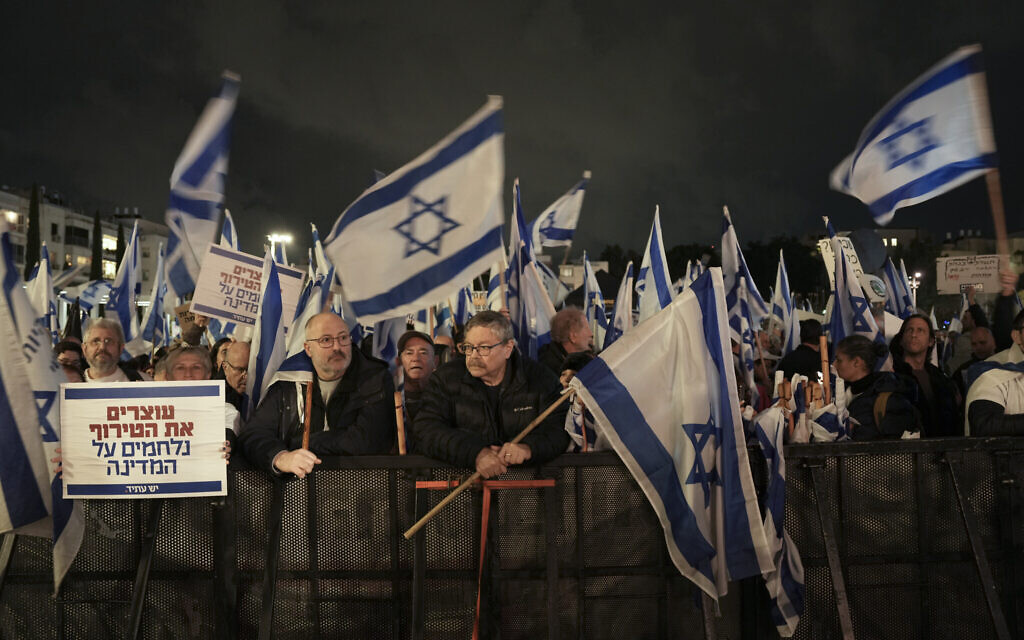 Israelis protest against Benjamin Netanyahu's government, in Tel Aviv, on January 14, 2023. (AP Photo/Oded Balilty)