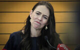 New Zealand Prime Minister Jacinda Ardern grimaces as she announces her resignation at a press conference in Napier, New Zealand January 19, 2023. (Warren Buckland/New Zealand Herald via AP)