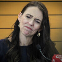 New Zealand Prime Minister Jacinda Ardern grimaces as she announces her resignation at a press conference in Napier, New Zealand January 19, 2023. (Warren Buckland/New Zealand Herald via AP)