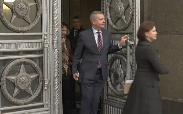 In this handout photo taken from video released by Russian Foreign Ministry Press Service, Estonian Ambassador to Russian Federation Margus Laidre leaves the Russian Foreign Ministry's building in Moscow, Russia, January 23, 2023. (Russian Foreign Ministry Press Service via AP)