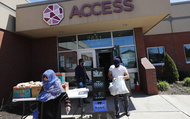 Workers at ACCESS, the Arab Community Center for Economic and Social Services, help with meals for the Arab community in Dearborn, Michigan, on May 1, 2020. (Carlos Osorio/AP)