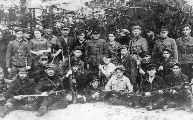 Group portrait of members of the Kalinin Jewish partisan unit (Bielski group) on guard duty at an airstrip in the Naliboki Forest, 1941-1944. (Courtesy of Photo Archivist, Archival Affairs Branch, The David M. Rubenstein National Institute for Holocaust Documentation, United States Holocaust Memorial Museum)