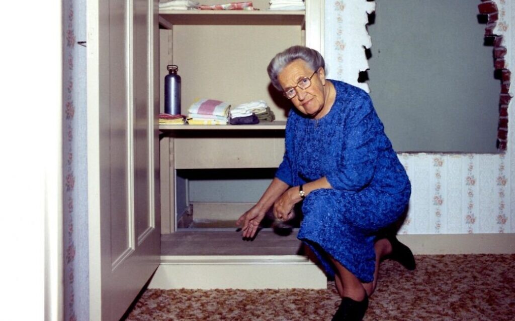 Corrie ten Boom shows the hiding place in her home in Haarlem, the Netherlands (courtesy: Corrie ten Boom House)