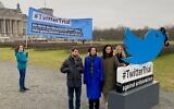 Members of the European Union of Jewish Students stand outside the Bundestag, Germany's parliament, as they announce a lawsuit against Twitter over antisemitism on the platform, January 25, 2023. (Courtesy EUJS via JTA)