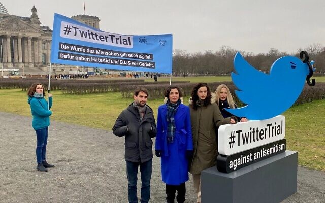 Members of the European Union of Jewish Students stand outside the Bundestag, Germany's parliament, as they announce a lawsuit against Twitter over antisemitism on the platform, January 25, 2023. (Courtesy EUJS via JTA)