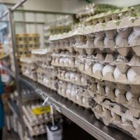 Eggs stacked on shelves at the Osher Ad supermarket in Givat Shaul, Jerusalem, October 27, 2021. (Yonatan Sindel/Flash90)