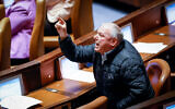 MK David Amsalem reacts during a plenum session of the Knesset on December 19, 2022. (Olivier Fitoussi/Flash90)