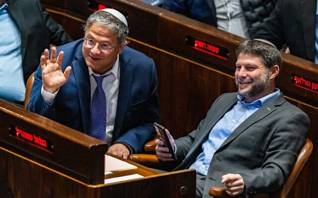 Religious Zionism party head MK Bezalel Smotrich (right) with Otzma Yehudit party head MK Itamar Ben Gvir in the Knesset, on December 28, 2022. (Olivier Fitoussi/Flash90)